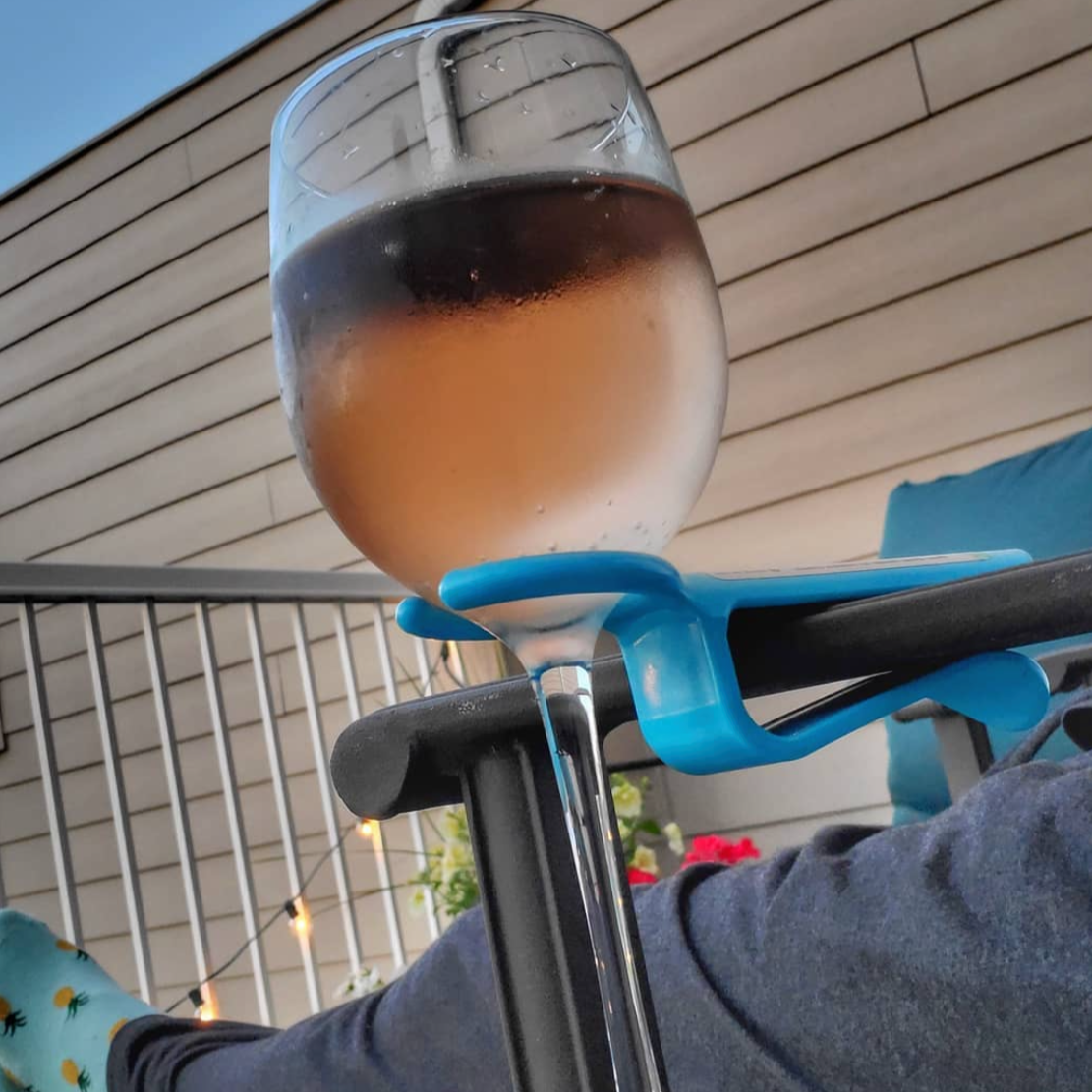 Blue wine holder on a patio chair