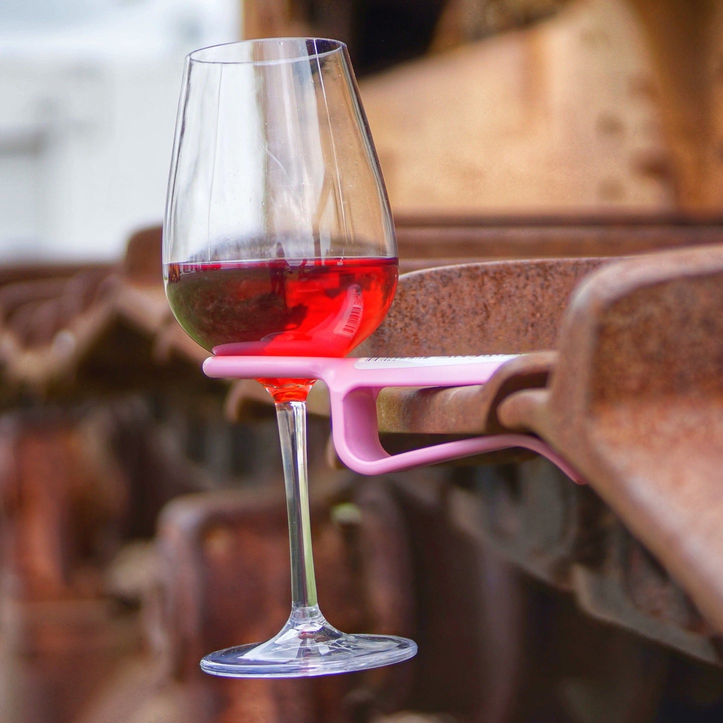 Pink wine glass holder on machinery equipment