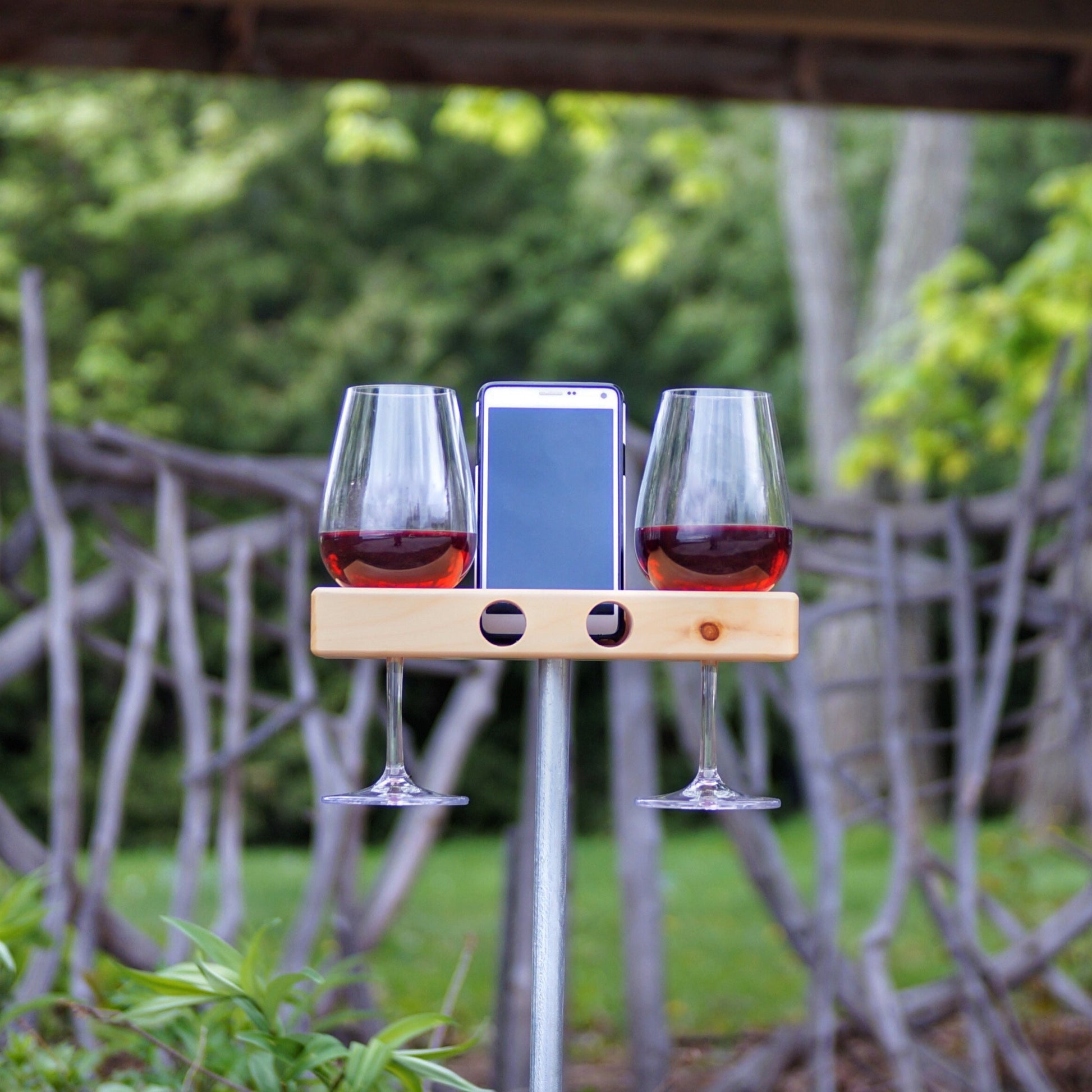 wine holder for camp. smartphone holder with built in speaker for outdoor use.